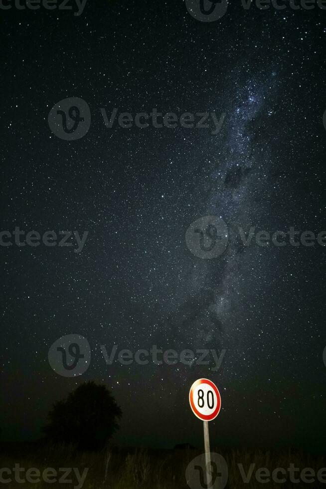 Maximum speed road sign with a stormy sky background, La Pampa province, Patagonia, Argentina. photo