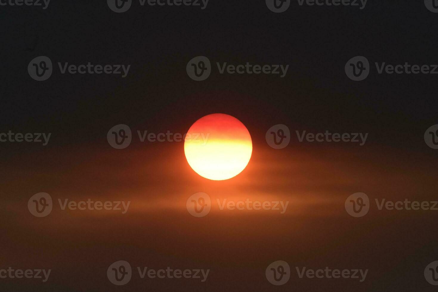 Beautiful orange sun at sunset photo