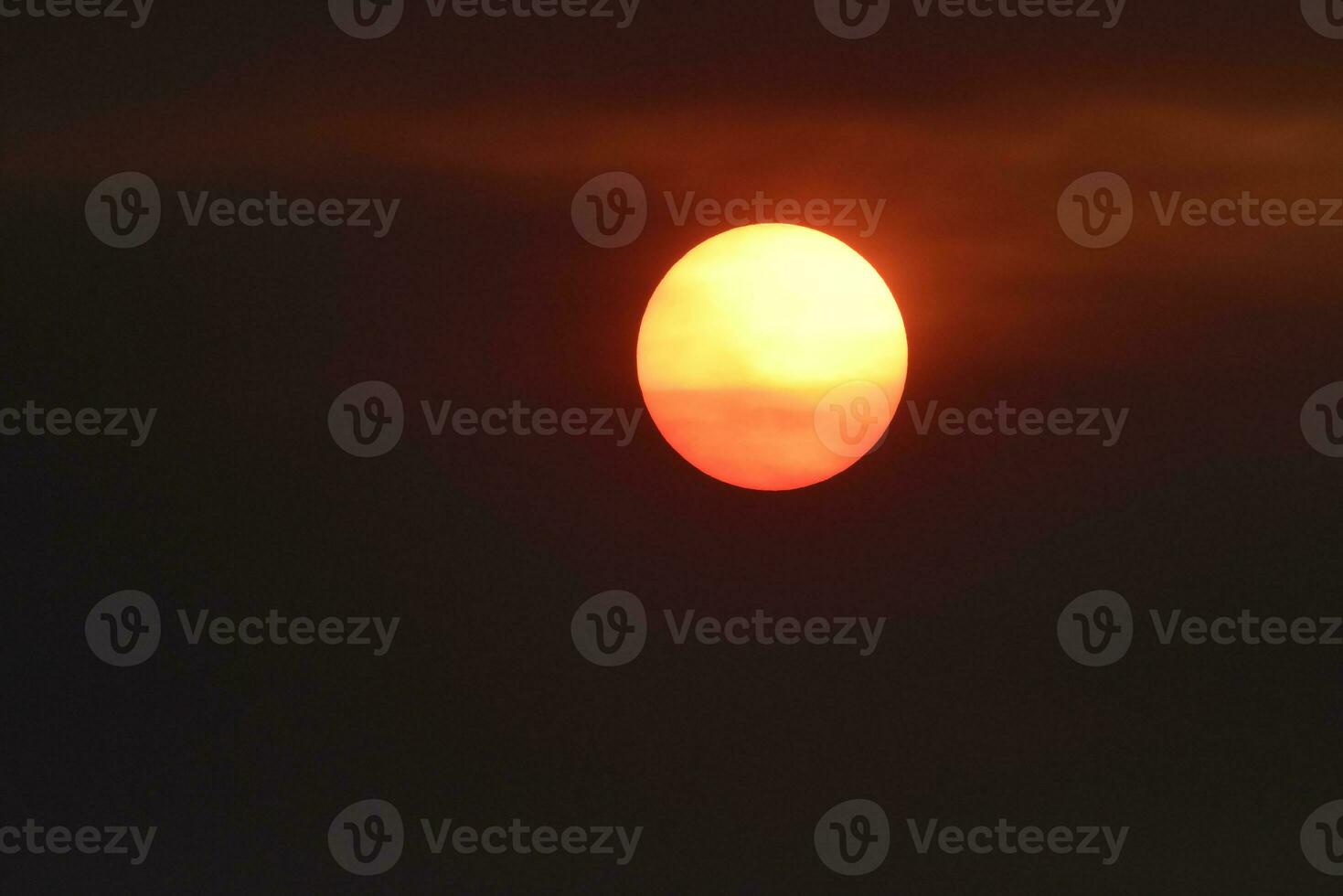 Beautiful orange sun at sunset photo