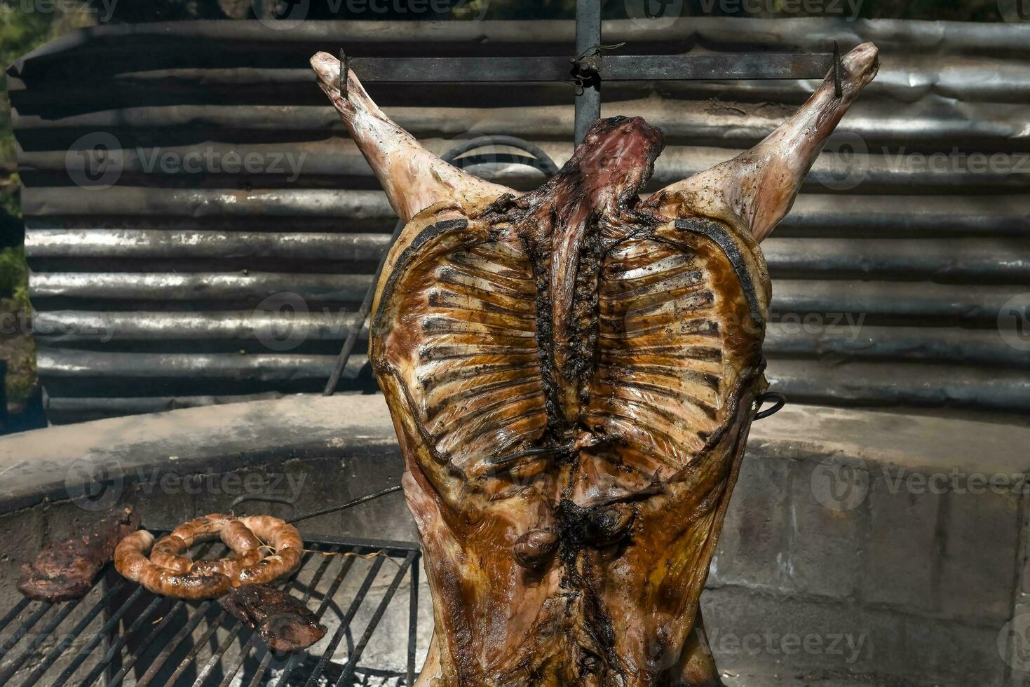 Lamb on the spit, cooked with the traditional Argentine method, La Pampa province, Patagonia, Argentina. photo