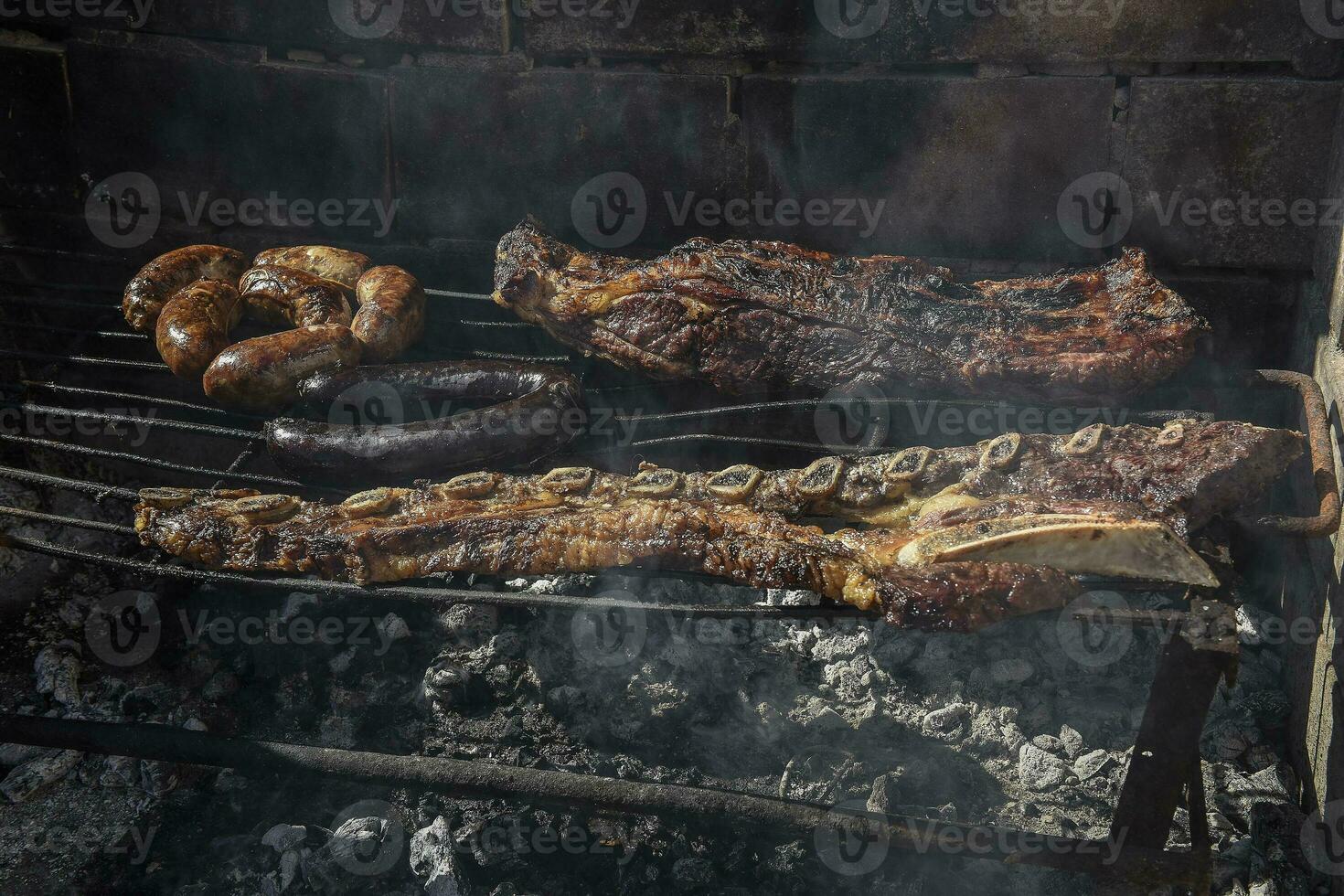 Barbecue, grilled sausages and cow meat , traditional argentine cuisine photo