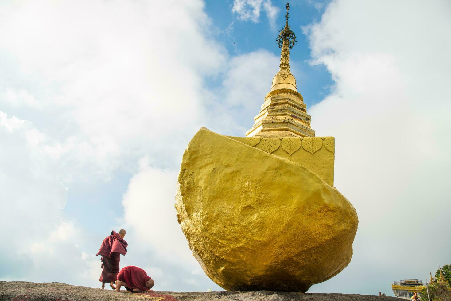 Burmese monk make a worship to Kyaukthanban pagoda near Kyaiktiyo pagoda in Mon state of Myanmar. photo