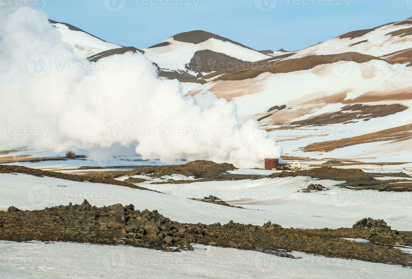 The scenery view of Krafla geothermal power station with the landscape of the mountains after snowing in Myvatn, North Iceland. photo