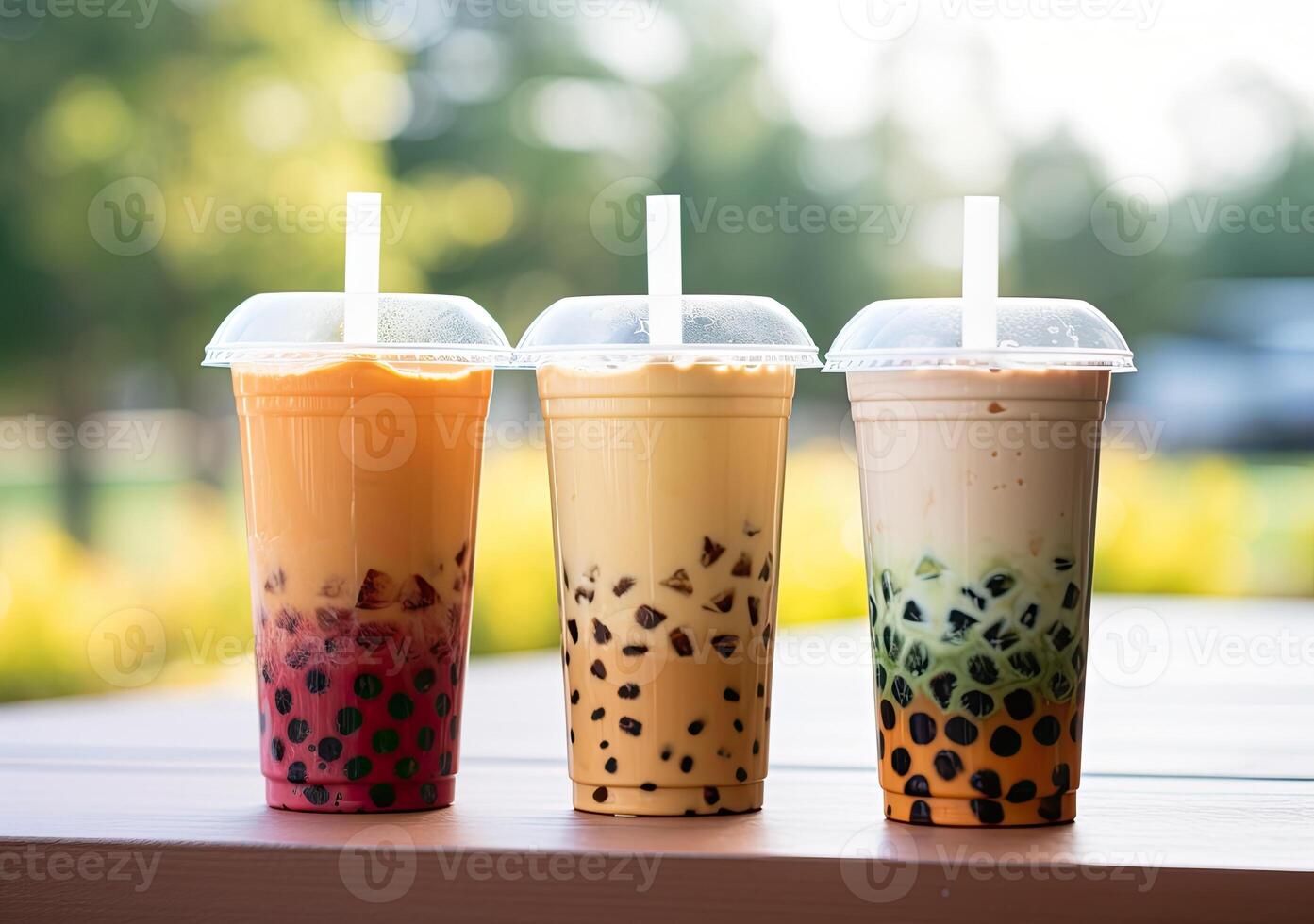 illustration of product photo of 3 plastic cups of boba milk tea, with bubbles, fun, blurry outdoor and nature background