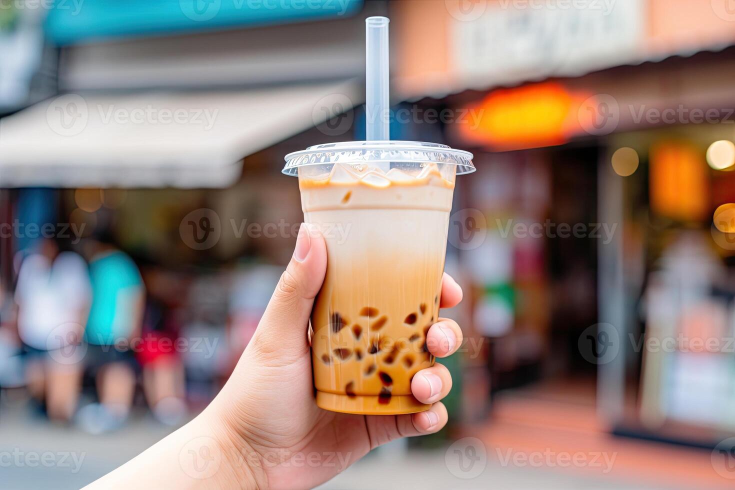 illustration of hand holding Taiwan milk tea and blurry background photo