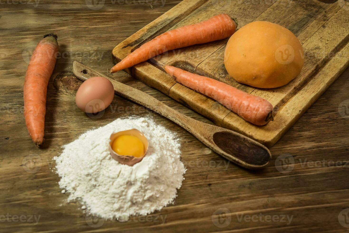 Orange dough bun for noodles with ingredients on the table. photo
