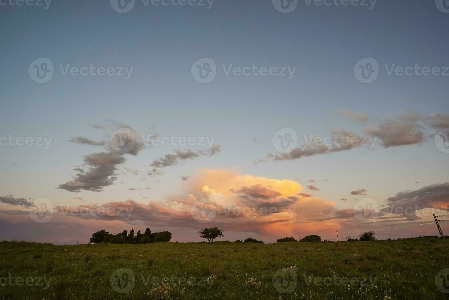 Stormy sky at sunset in the pampas field, La Pampa, Argentina. photo