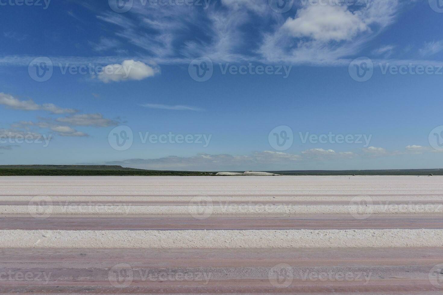 Salty lagoon prepared to extract raw salt, mining industry in Argentina photo