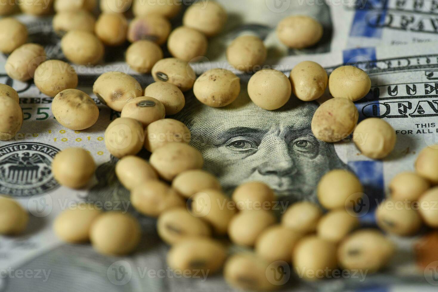 Dollars banknotes and coins and soy beans, commoditi value concept. photo