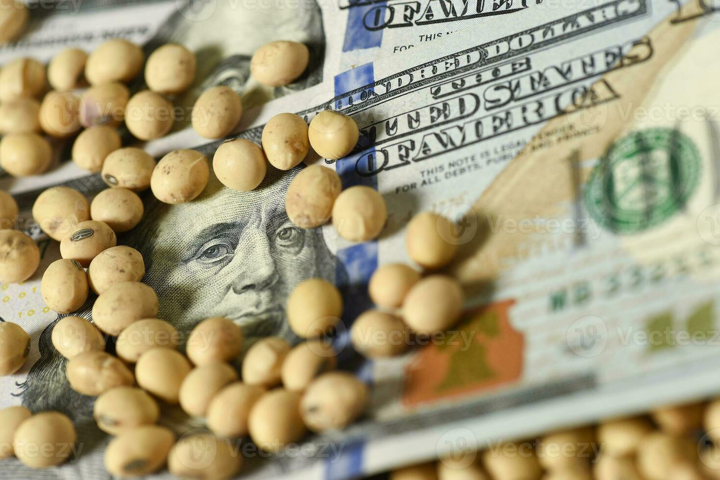 Dollars banknotes and coins and soy beans, commoditi value concept. photo