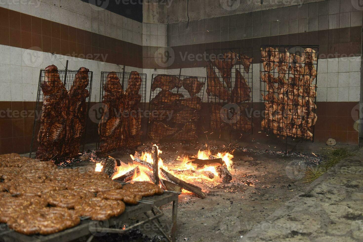 Gaucho roast barbecue, sausage and cow ribs, traditional argentine cuisine, Patagonia, Argentina. photo