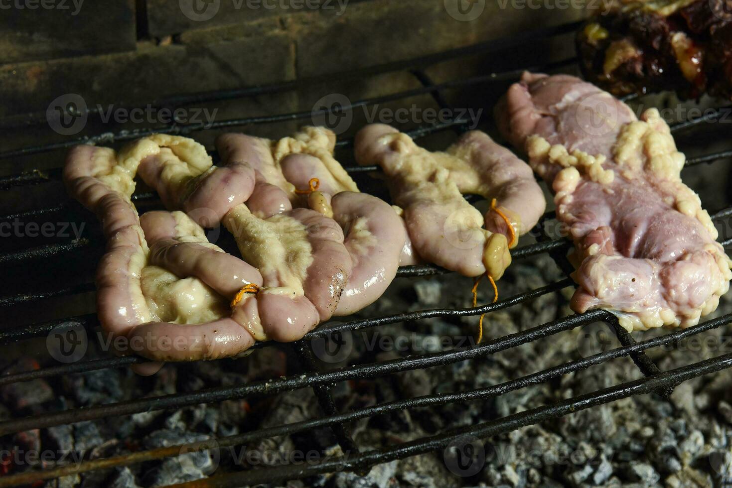 Cow bowels presented on a grill. Argentine Traditional cuisine. photo