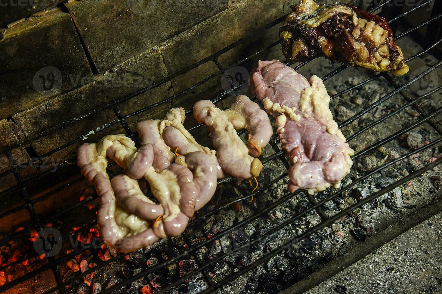 Cow bowels presented on a grill. Argentine Traditional cuisine. photo