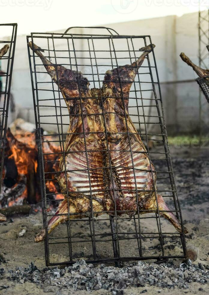 Lamb on the spit, Patagonia, Argentina. photo