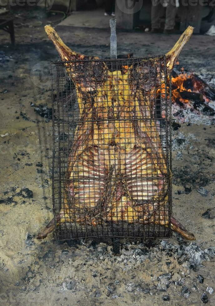 Lamb on the spit, Patagonia, Argentina. photo