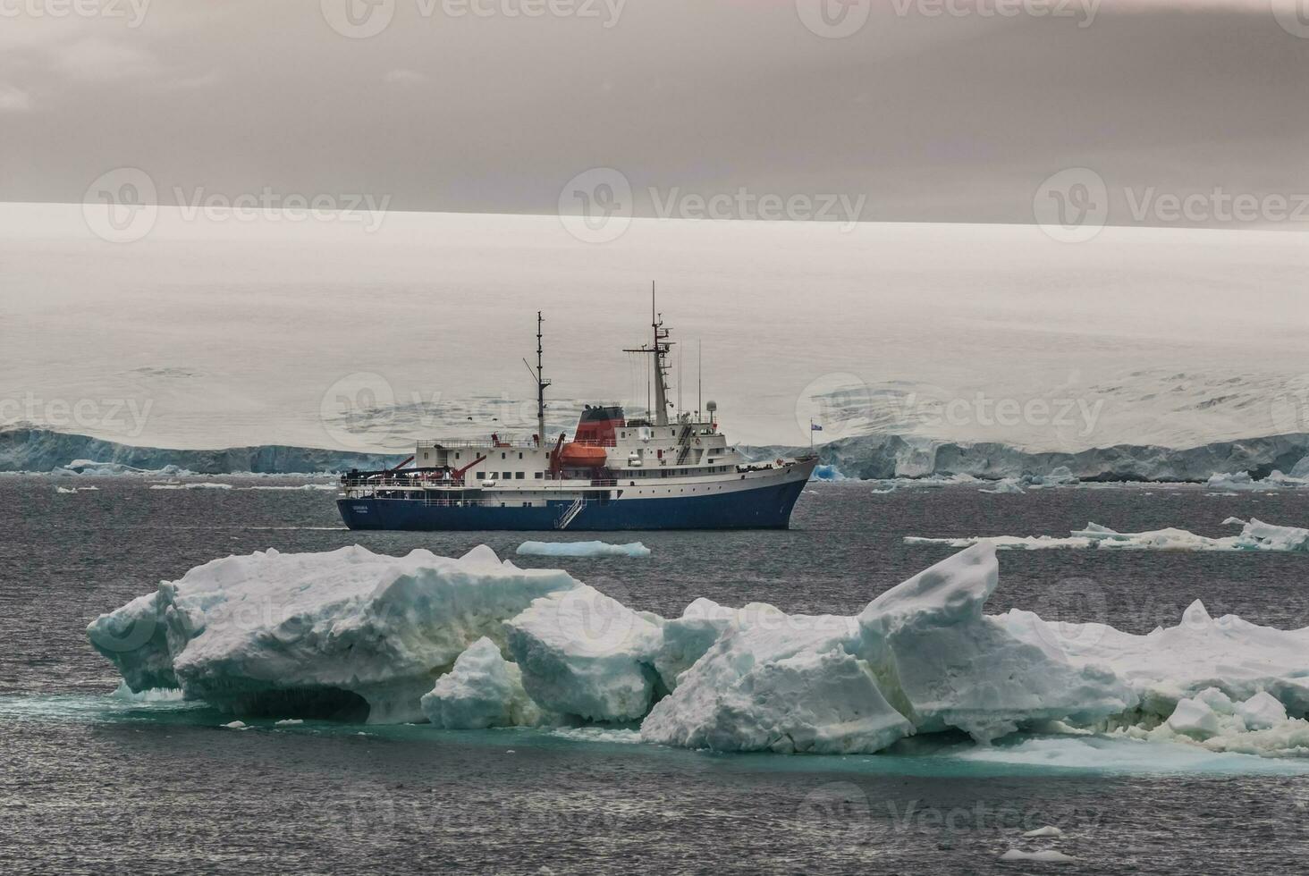 Expedition ship, cruise in Antarctic landscape, Paulet island, near the Antarctic Peninsula photo