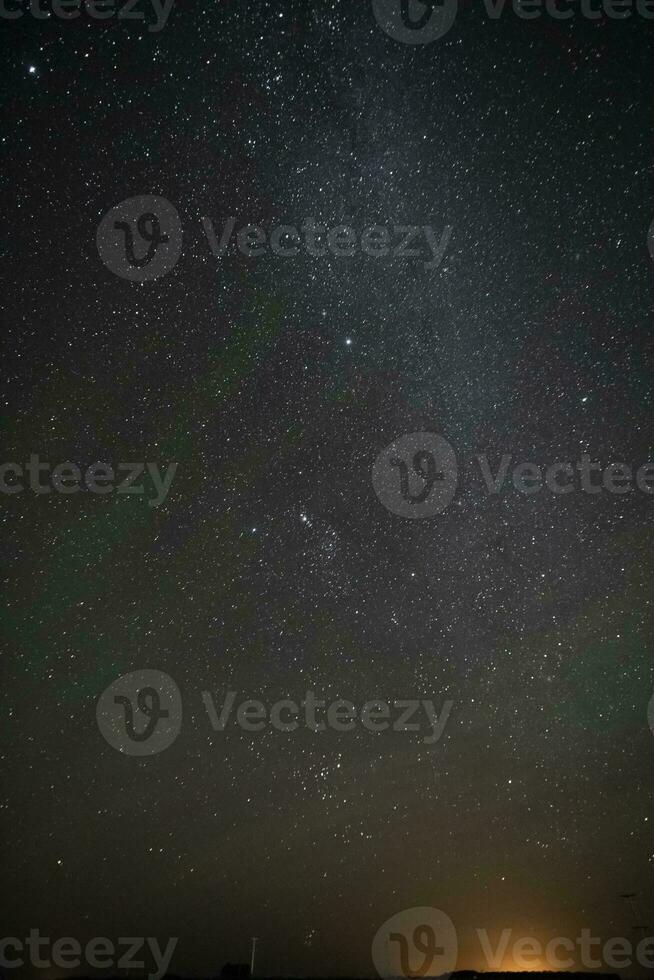 Starry sky reflected in the water, La Pampa Province, Patagonia, Argentina. photo