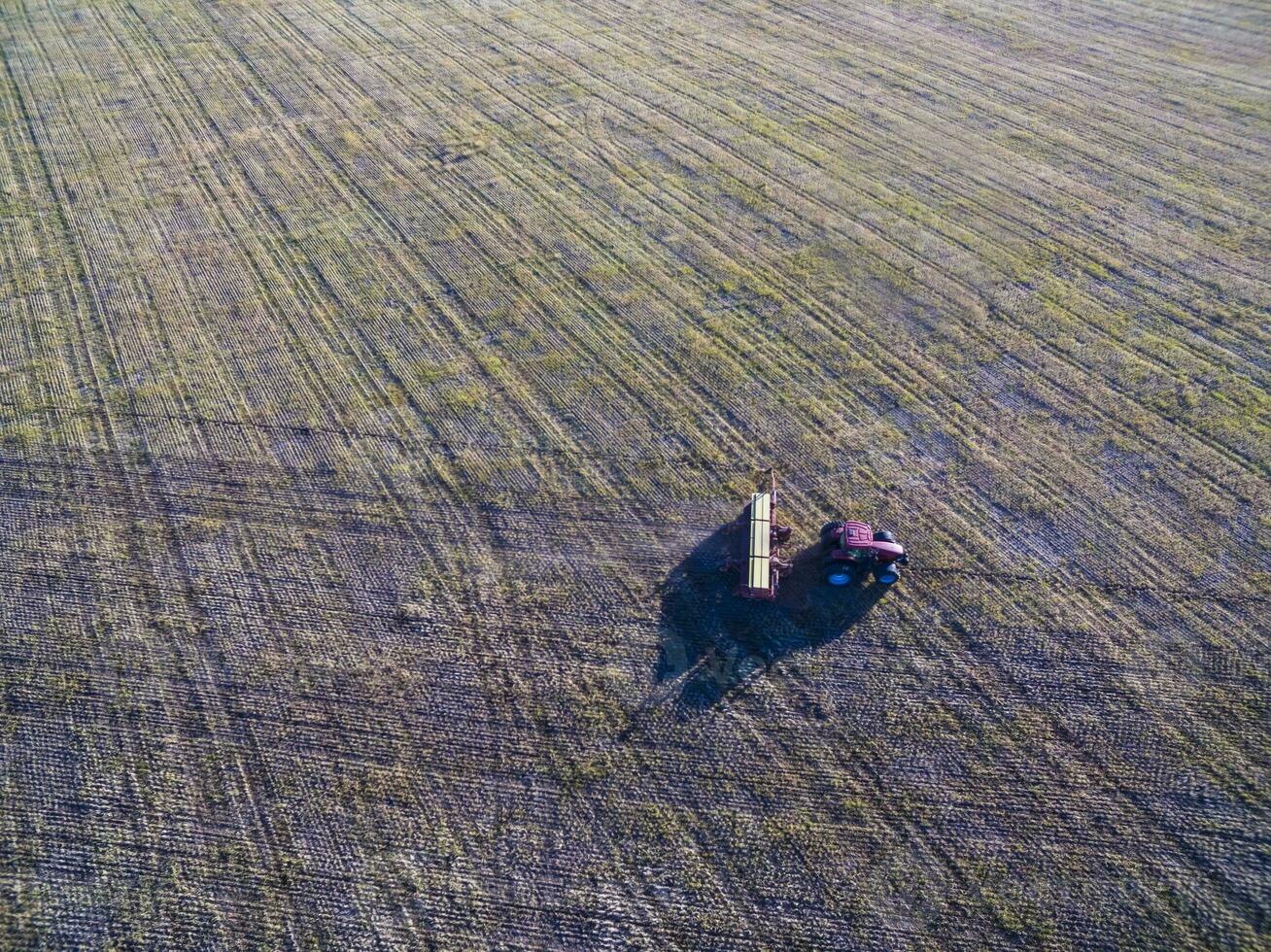 Tractor and seeder, direct sowing in the pampa, Argentina photo