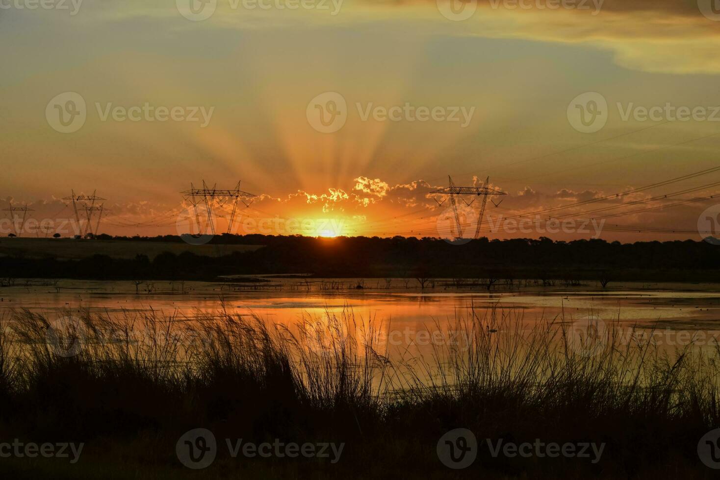 Sunbeams at sunset, in pampas landscape, Patagonia Argentina photo