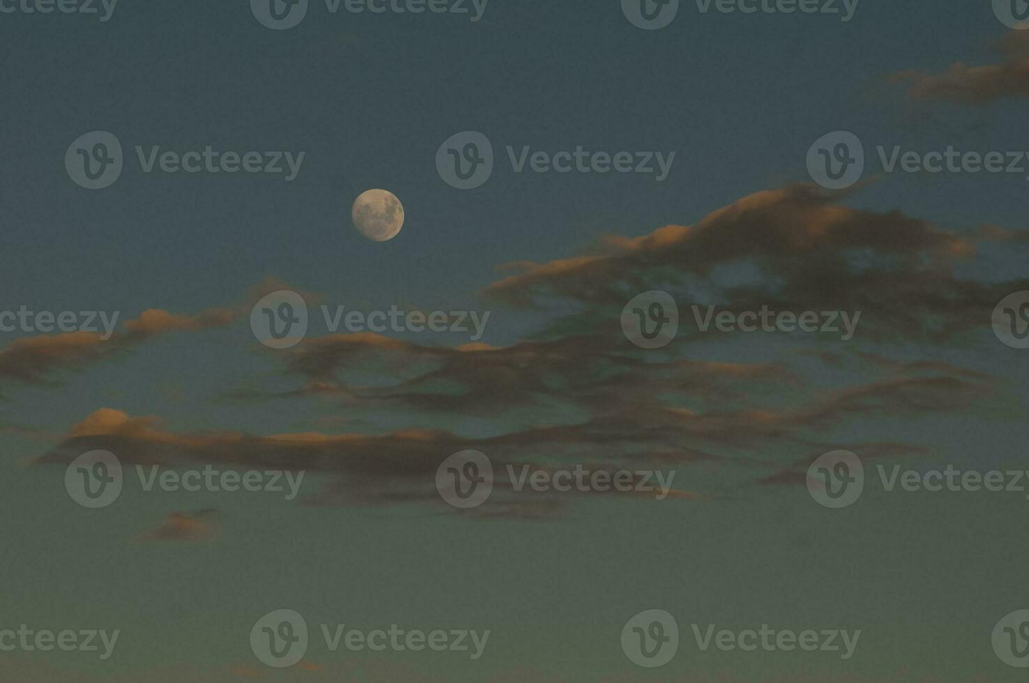 Moon in a sky with clouds,Patagonia Argentina photo