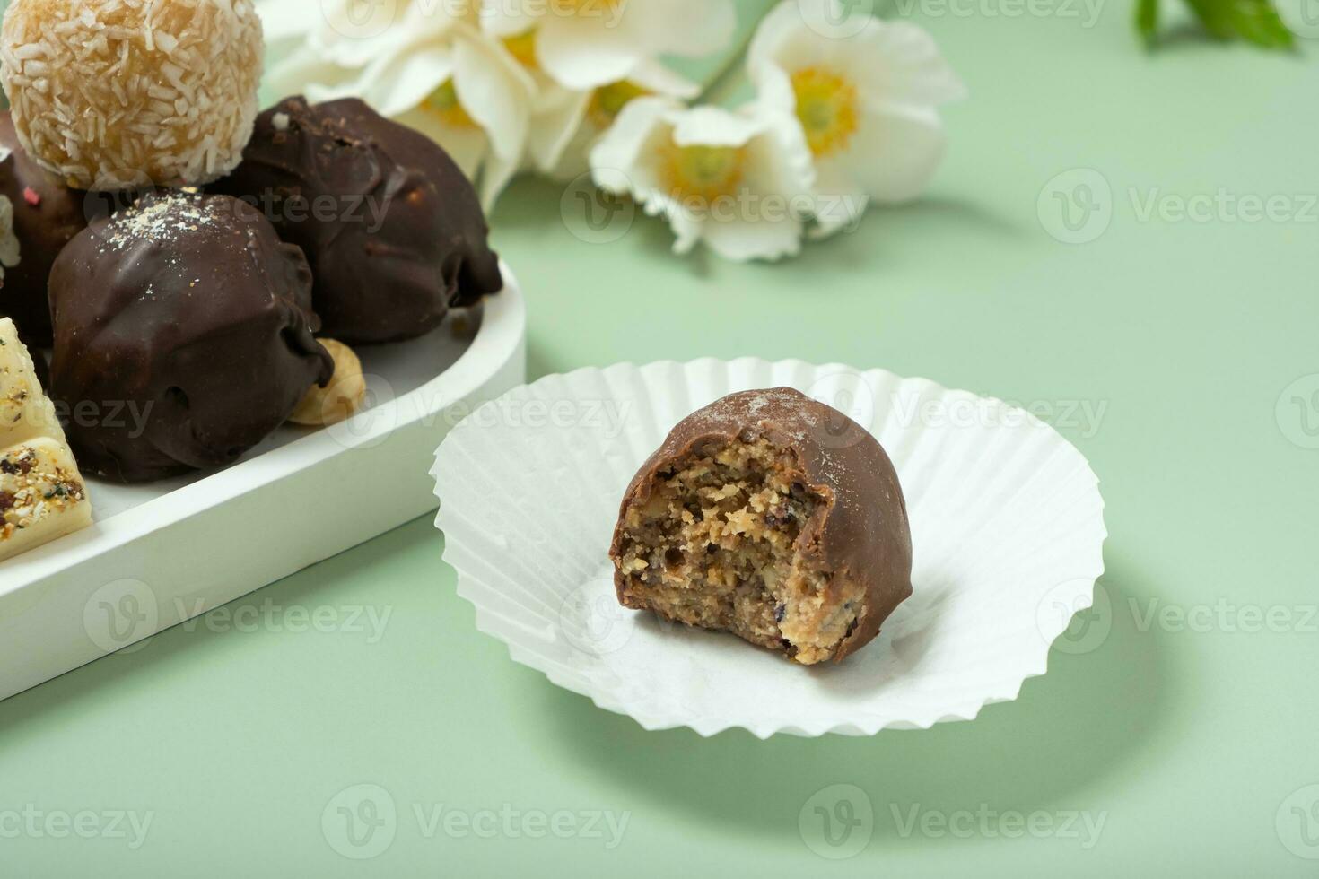 Bitten healthy craft candy with nuts photo
