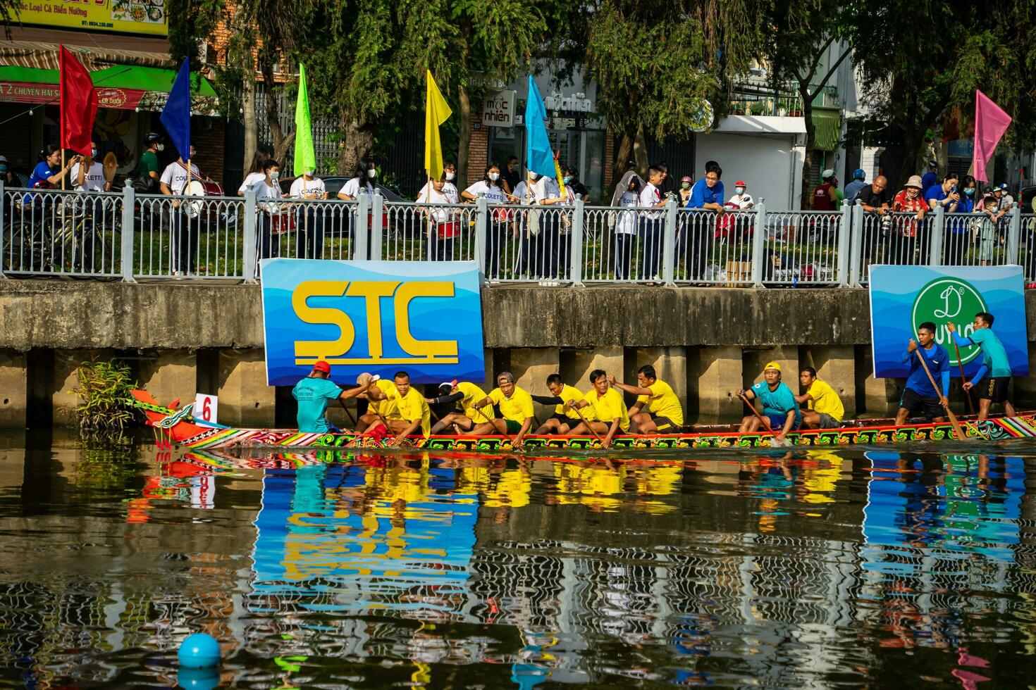 Ho Chi Minh, Viet Nam - 23 April 2023 Blurry motion of boat racing in the traditional Ngo boat racing festival of Khmer people photo