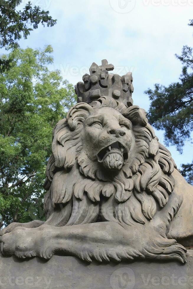 Statue of lion with crown. European statue of lion. Prague. photo