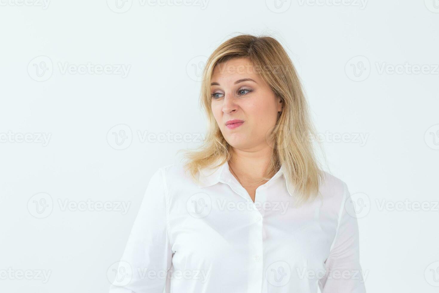 Woman with disgust emotion on white background with copy space and empty space for text photo
