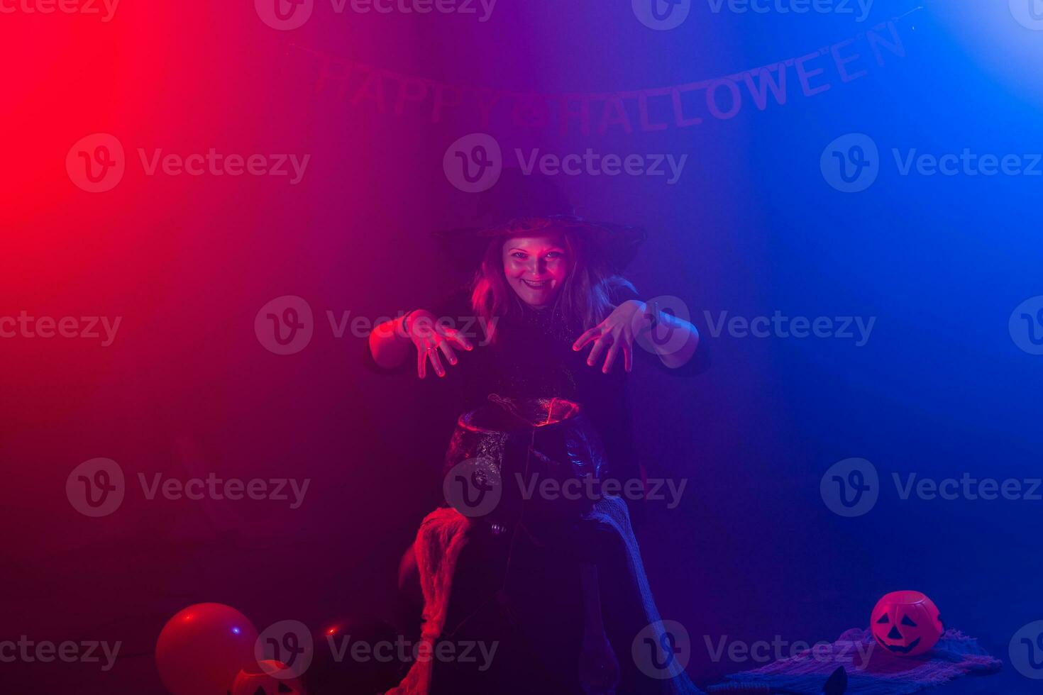 Woman in witch costume for Halloween. Masquerade night photo