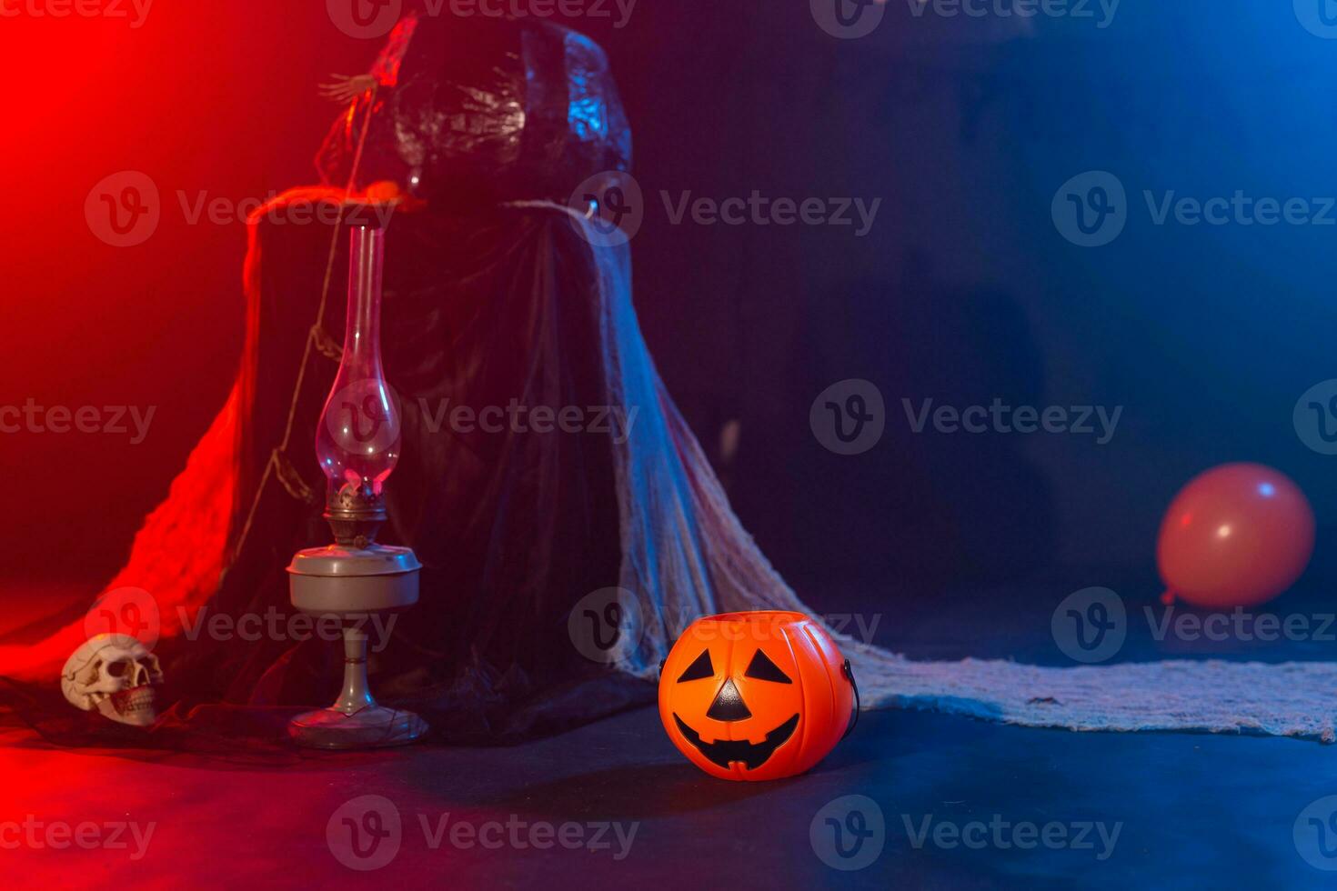 Symbol of Halloween. Jack-o-lantern on a dark background. Halloween card. Lamp in decorations. Background. photo