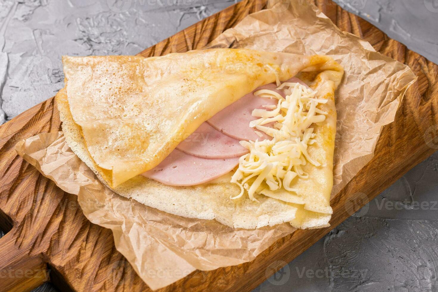 French crepe pancakes stuffed ham and cheese photo