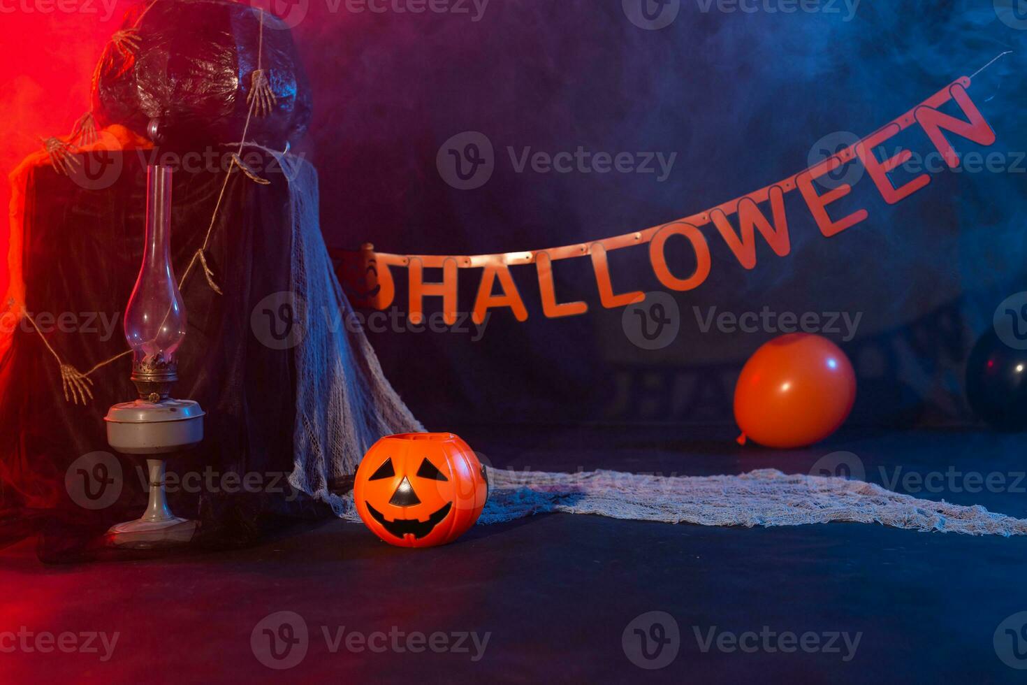 Symbol of Halloween. Jack-o-lantern on a dark background. Halloween card. Lamp in decorations. Background. photo