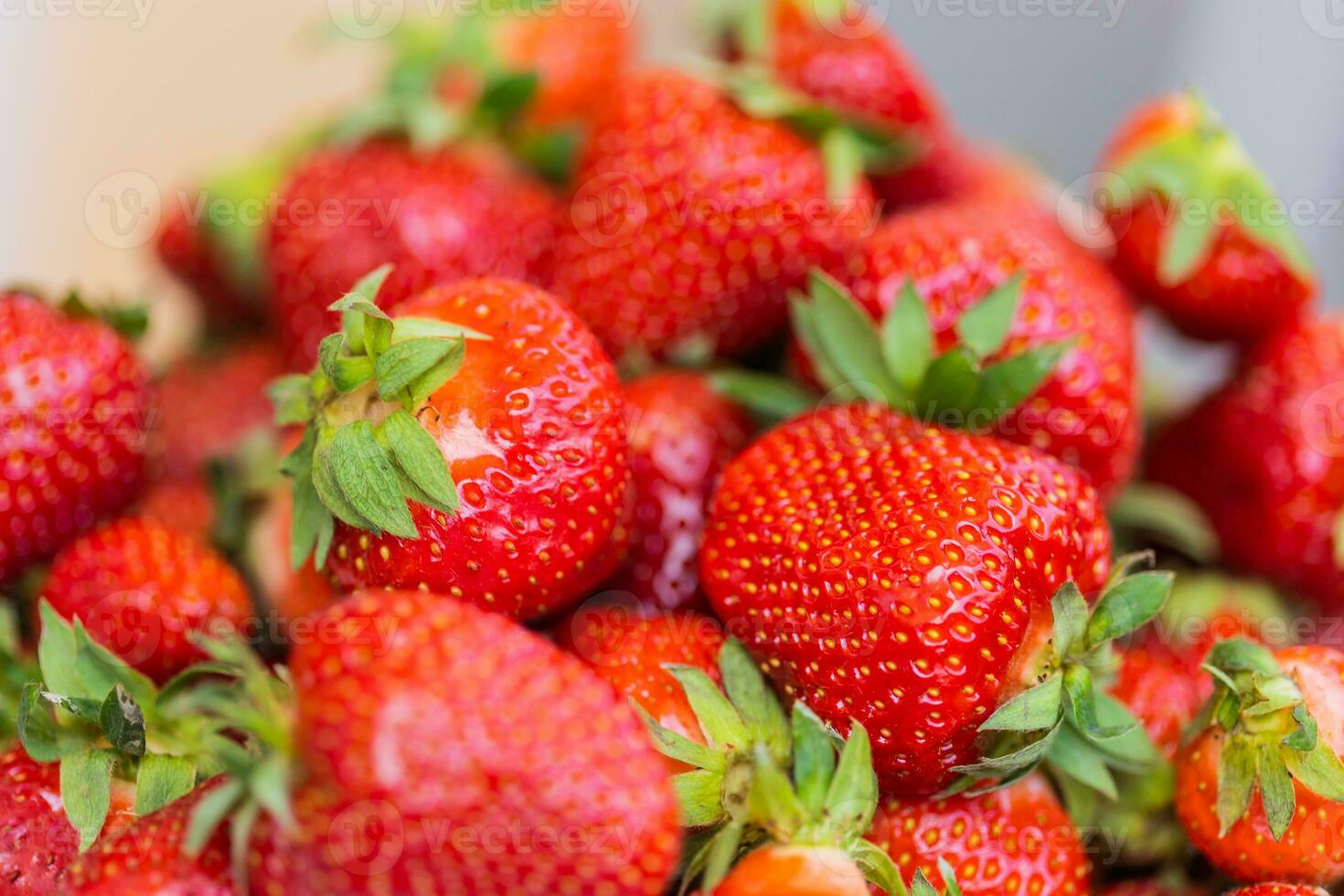 Fresh ripe delicious strawberries in bowl - healthy food and vegetarian photo