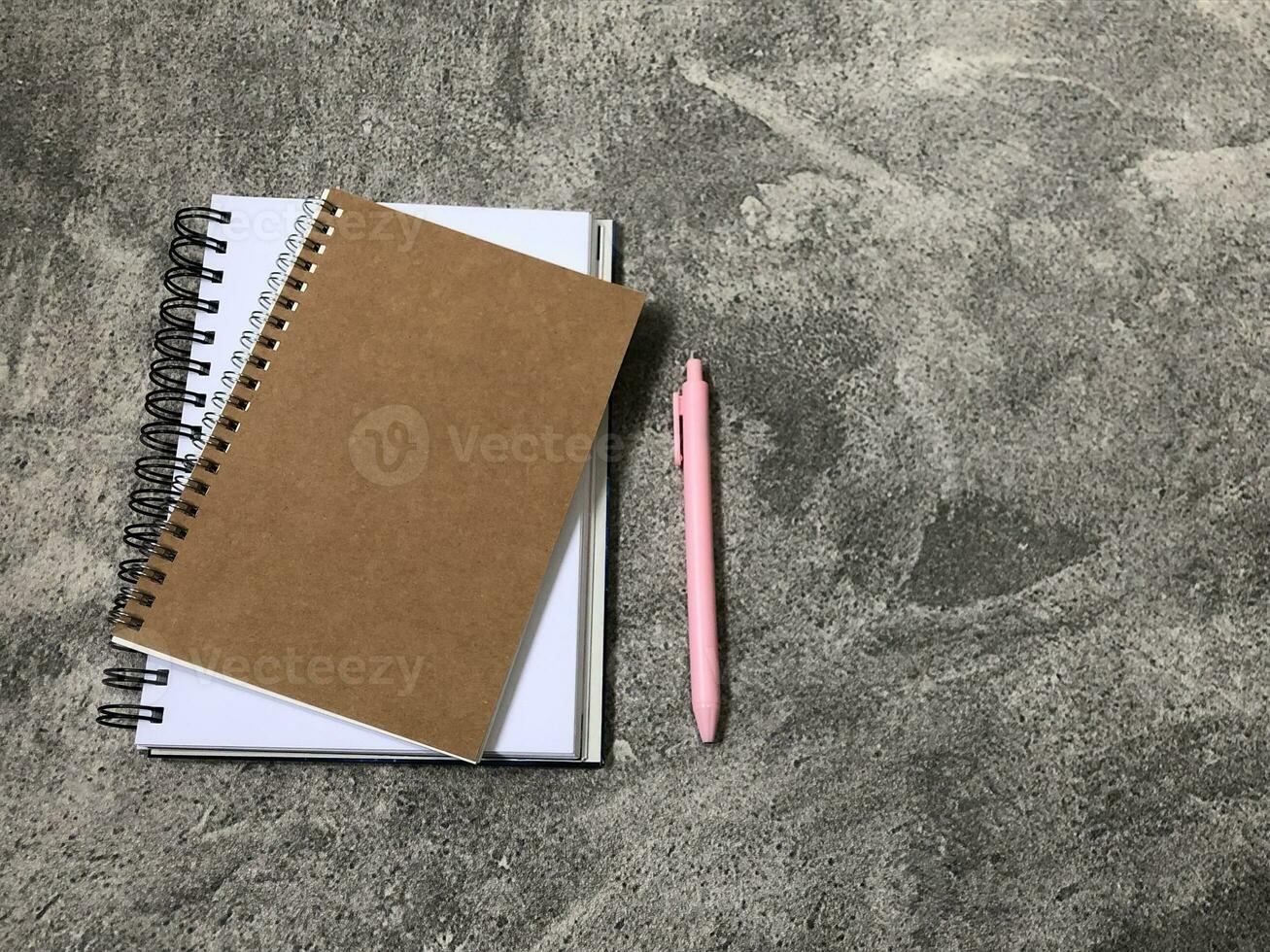 School books, office stationery, gray background photo