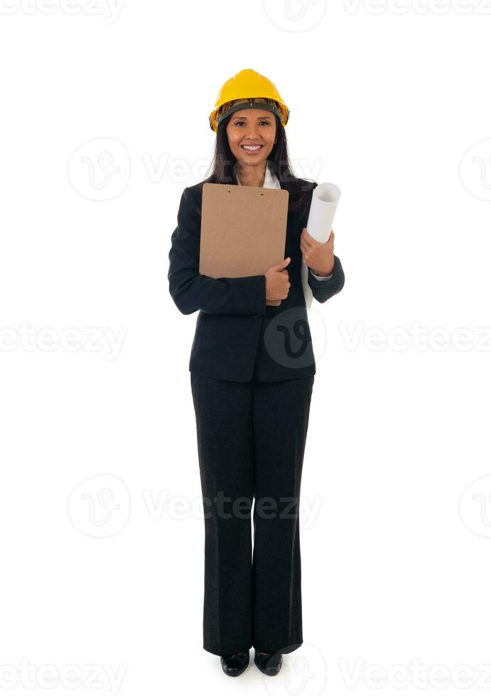 Full length of asian smiling woman architect holding blueprints and clipboard. Isolated portrait of woman engineer photo