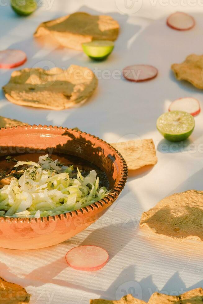 In Mexico, the vibrant red pozole is a delicious traditional comfort food photo