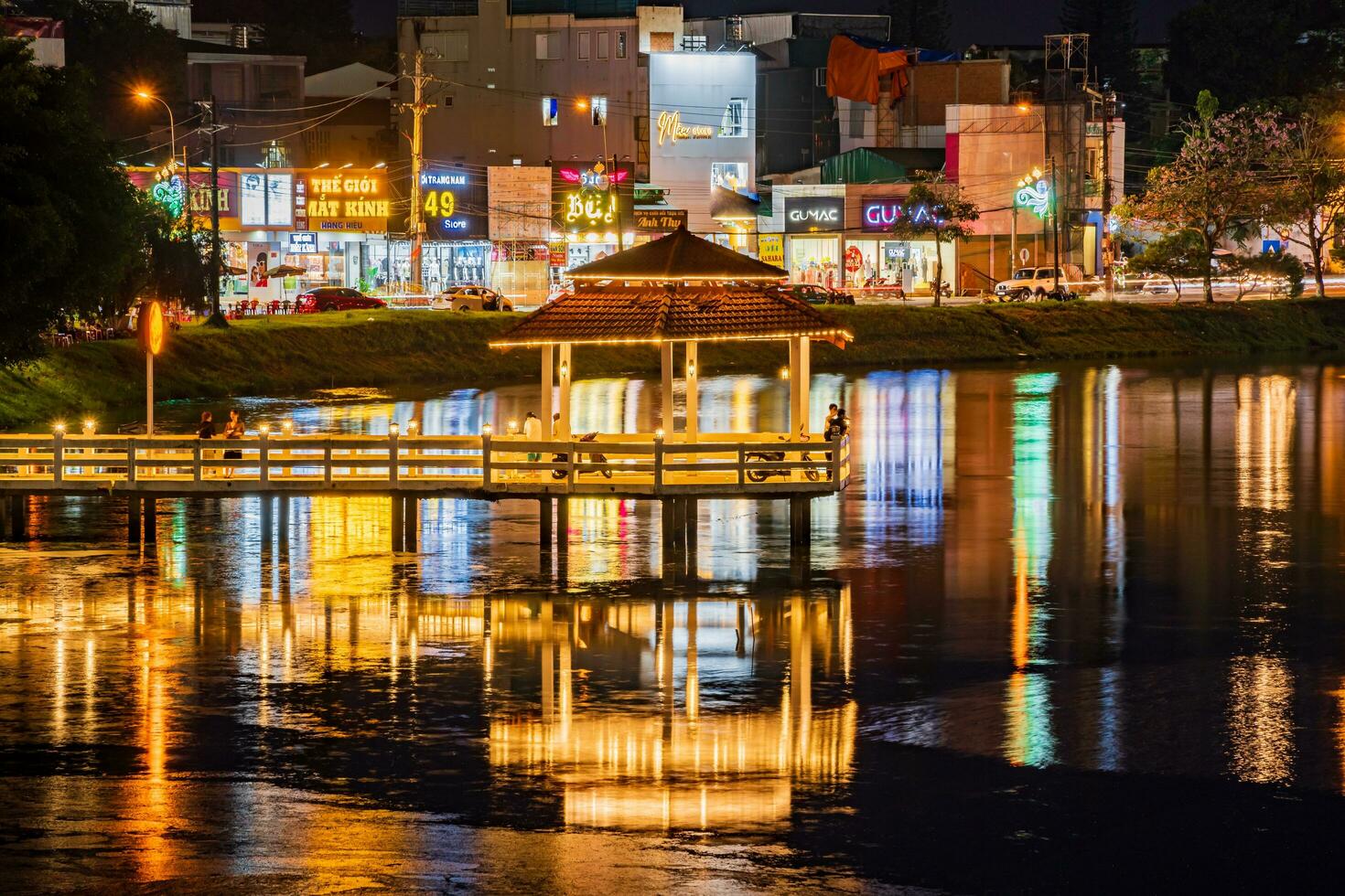 Bao Loc, Vietnam - 1 May 2023 Night view of small Dong Nai lake - a central lake in Bao Loc city. photo