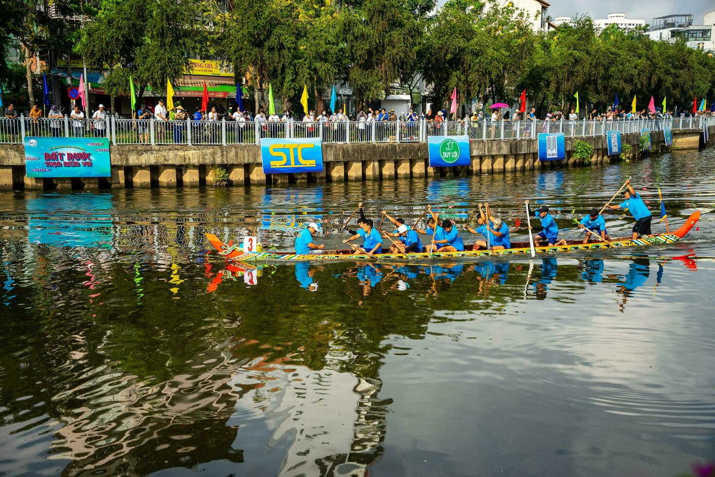Ho Chi Minh, Viet Nam - 23 April 2023 Blurry motion of boat racing in the traditional Ngo boat racing festival of Khmer people photo