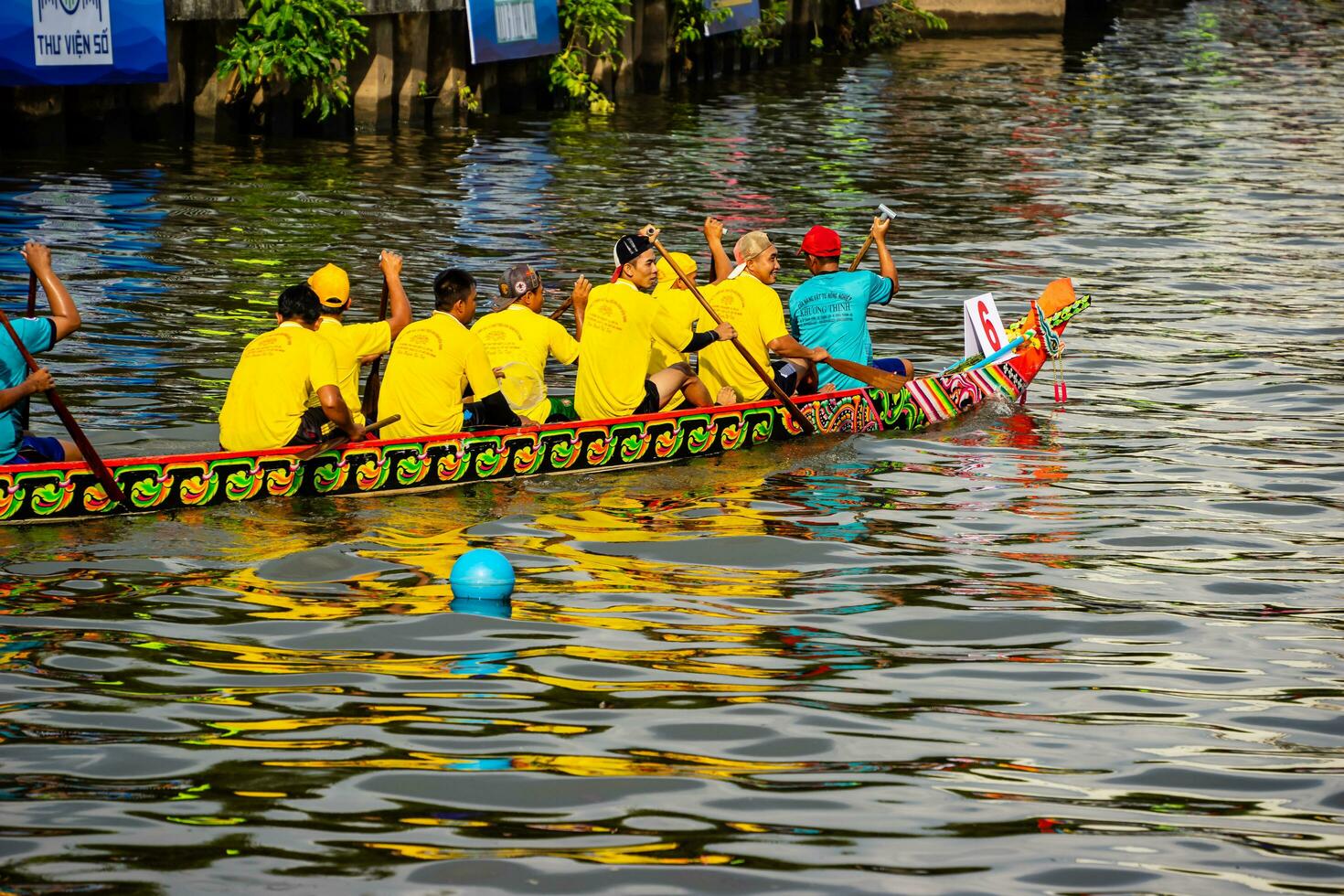 Ho Chi Minh, Viet Nam - 23 April 2023 Blurry motion of boat racing in the traditional Ngo boat racing festival of Khmer people photo