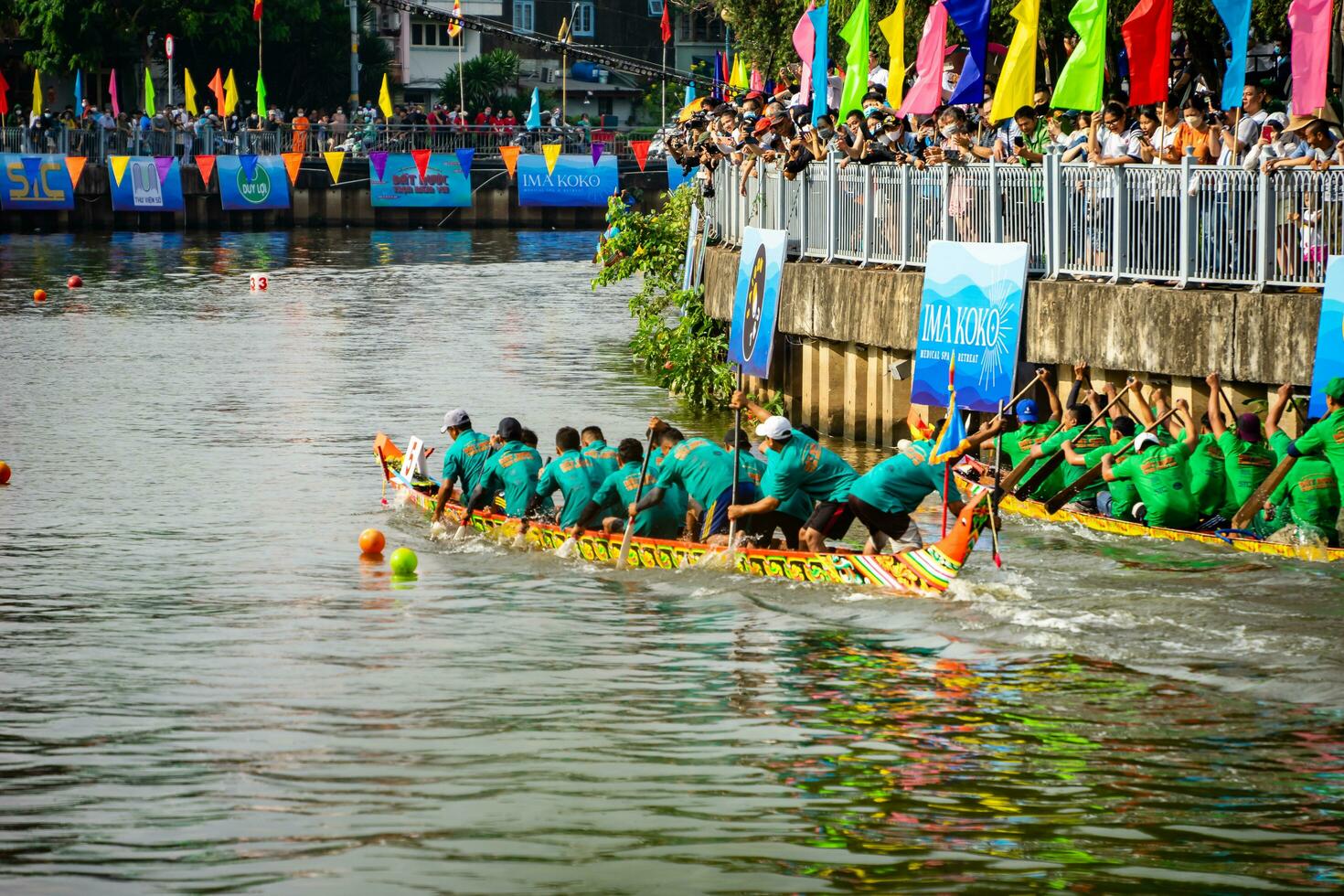 Ho Chi Minh, Viet Nam - 23 April 2023 Blurry motion of boat racing in the traditional Ngo boat racing festival of Khmer people photo