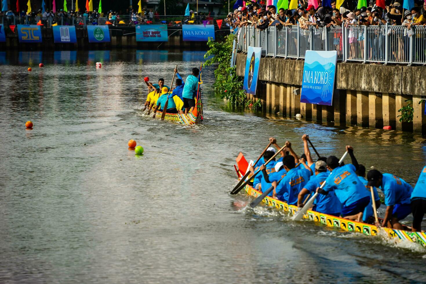 Ho Chi Minh, Viet Nam - 23 April 2023 Blurry motion of boat racing in the traditional Ngo boat racing festival of Khmer people photo