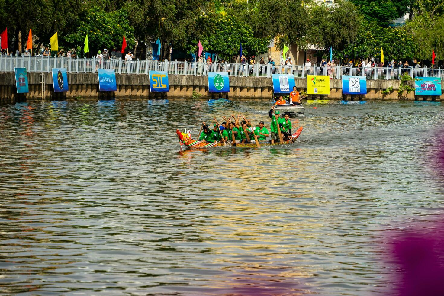 Ho Chi Minh, Viet Nam - 23 April 2023 Blurry motion of boat racing in the traditional Ngo boat racing festival of Khmer people photo