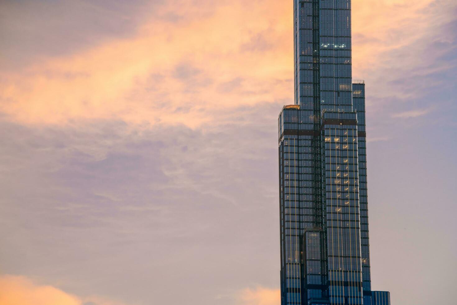 Ho Chi Minh, Viet Nam - 22 April 2023 Sunset at Landmark 81 with warm sunshine photo