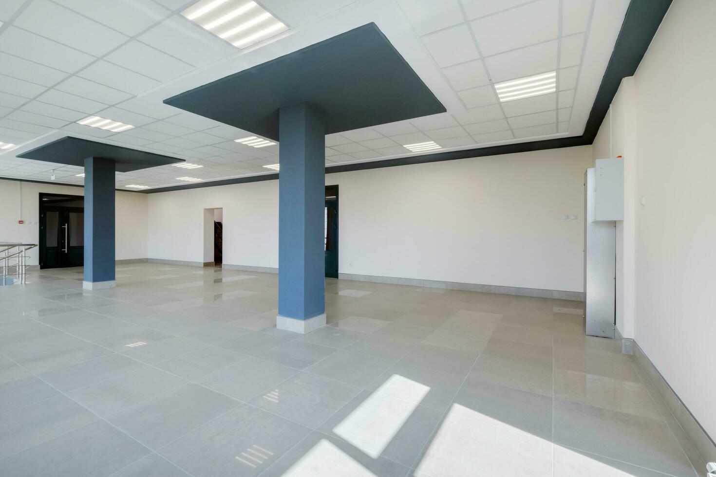 empty modern hall room with columns, doors and panoramic windows. photo