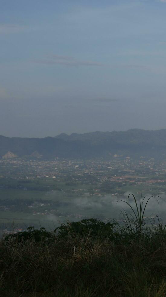 View of the mountains from the top of the hill photo
