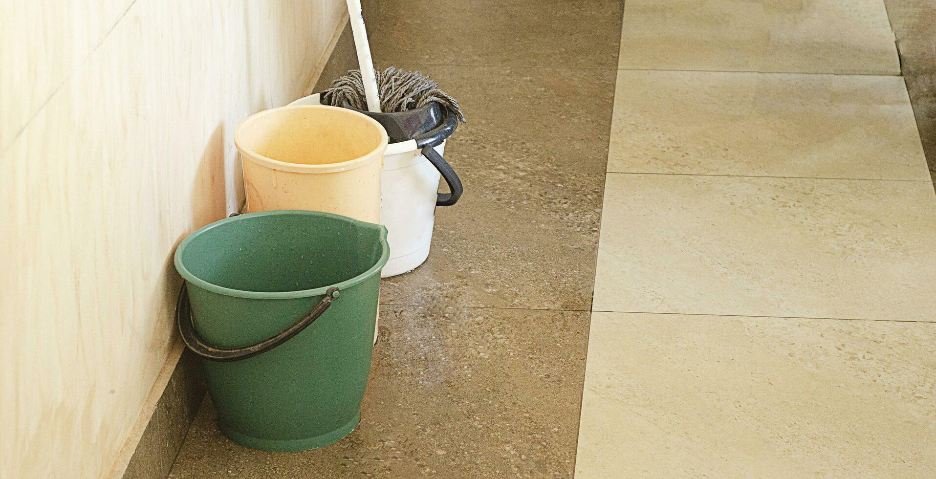 a mop with the bucket and two buckets for washing the floor photo