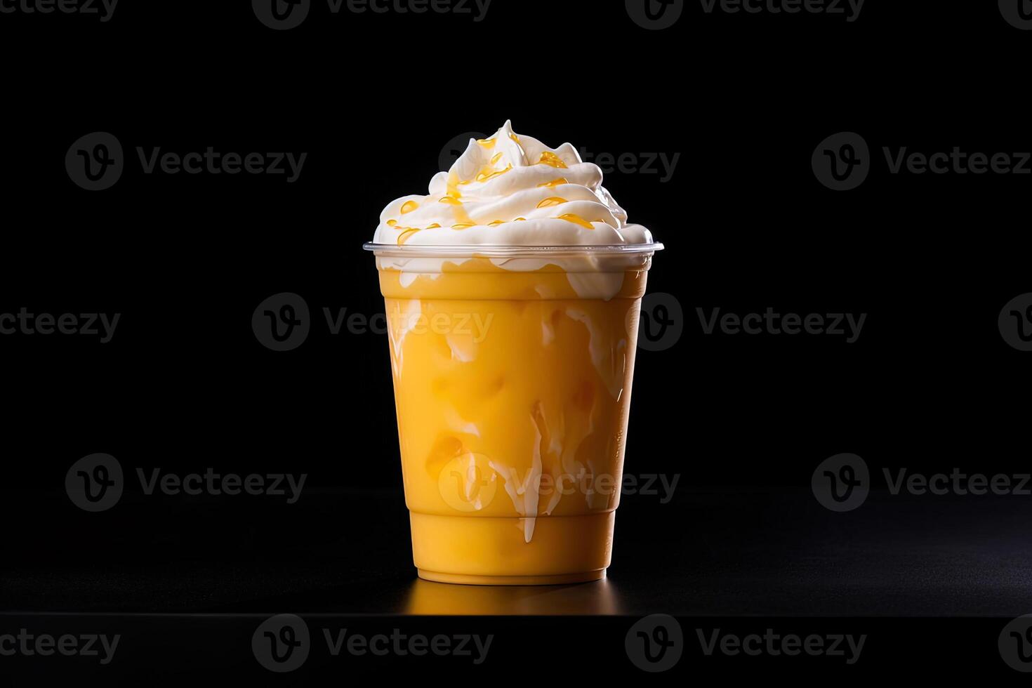 Mango smoothie milkshake in plastic takeaway cup isolated on dark background. photo