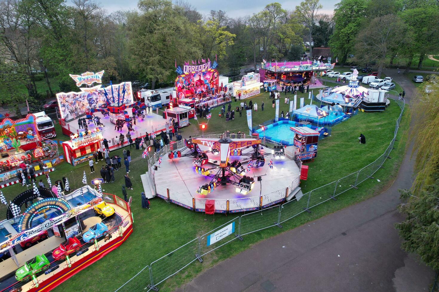 High Angle View of Local Public Carnival and Public Funfair Held for Eid Festival of Muslim Community at Wardown Public Park of Luton City of England UK on April 23rd, 2023 photo