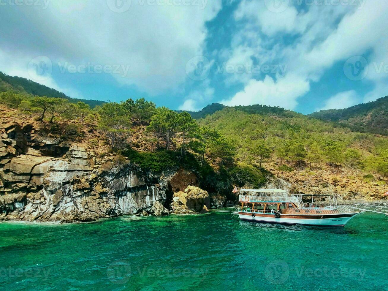 View from the sea to the mountains and the blue sky with clouds photo