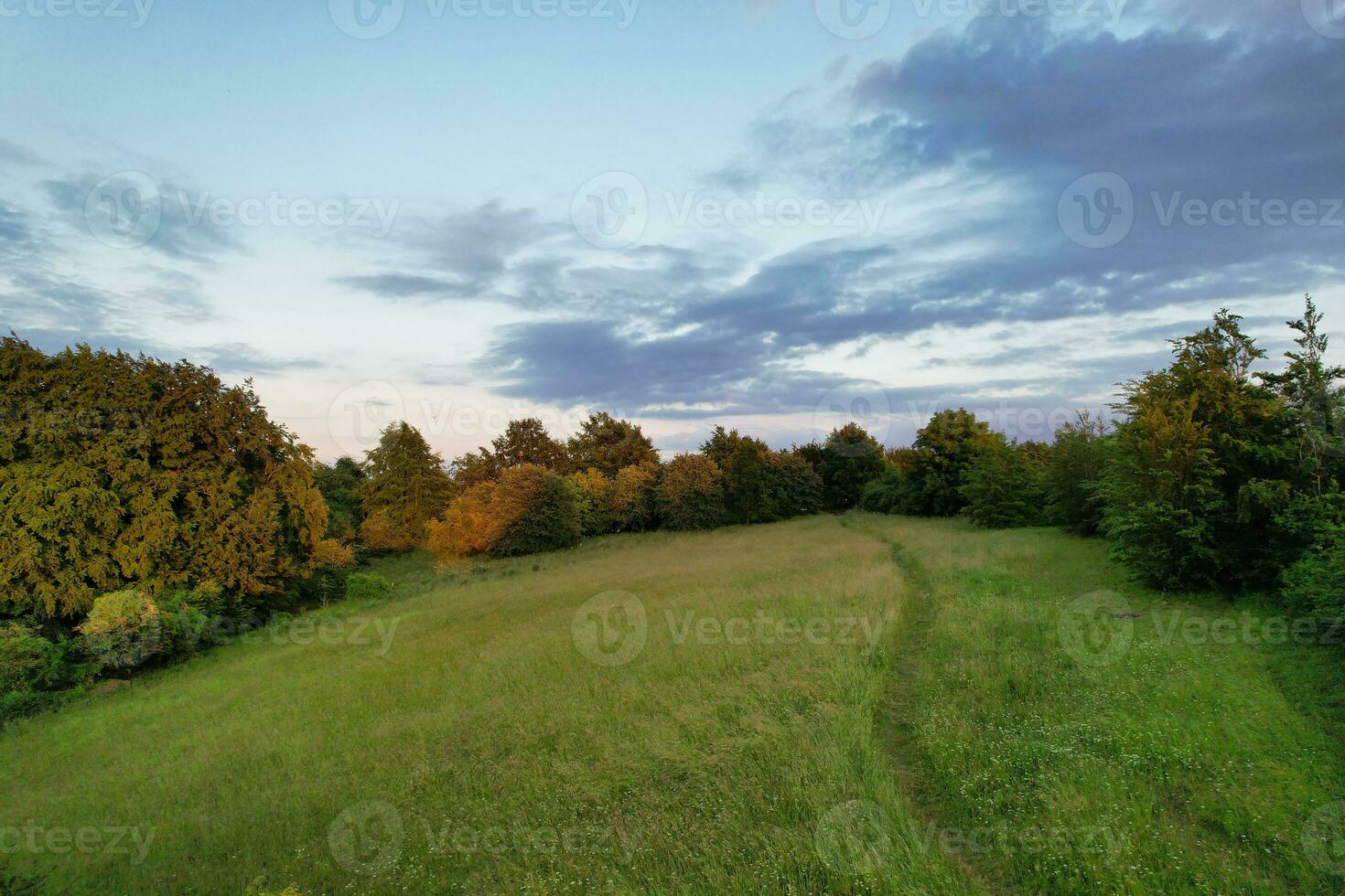 Beautiful Aerial View of  British Landscape and Sky with Clouds at Sharpenhoe Clappers Near Luton, England UK. Image Was Captured with drones Camera on June 24th, 2023 photo